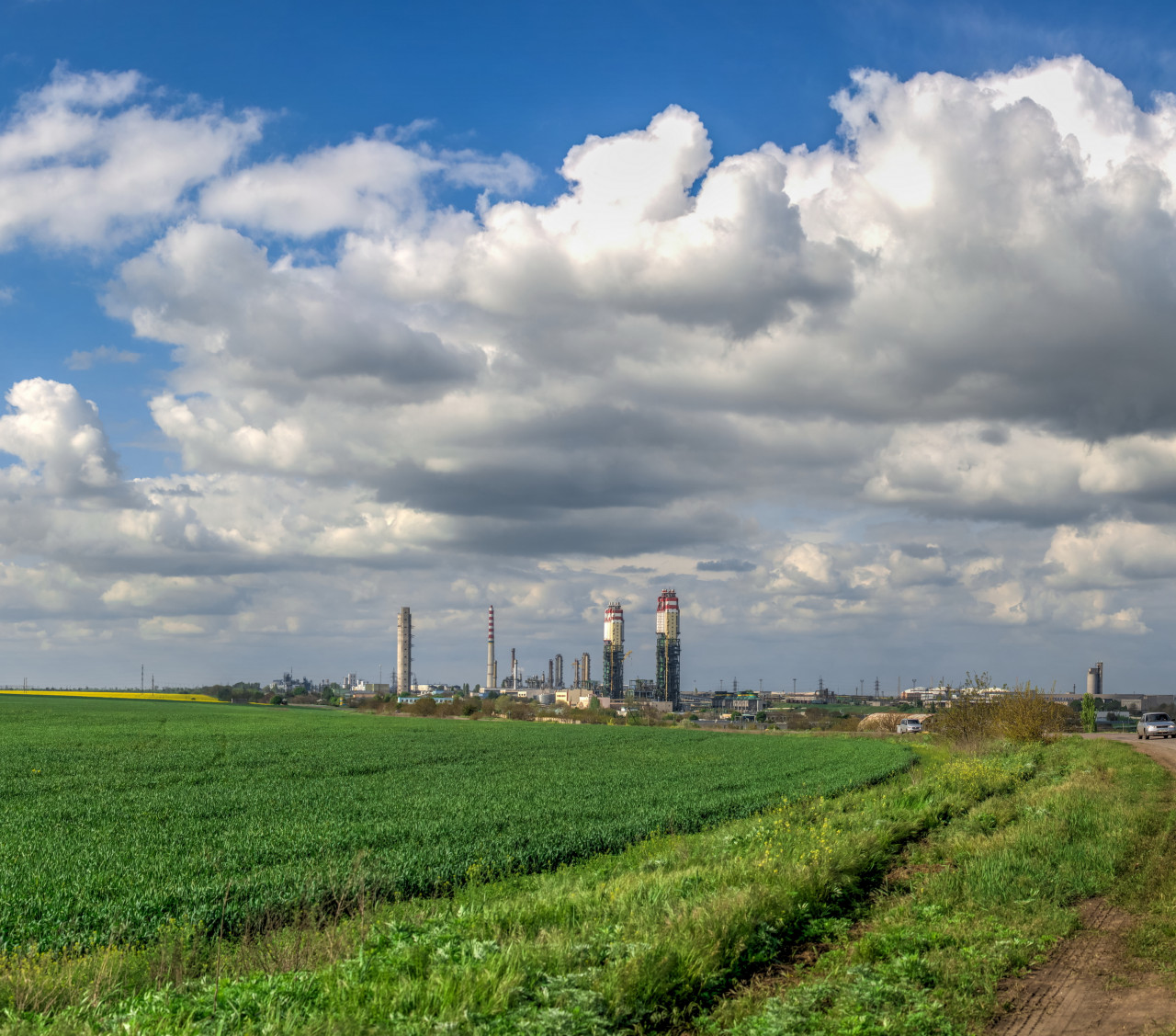 image of fertiliser plant and green fields